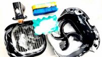 Cleaning air fryer using sponge.