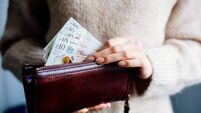 Woman Holding British Pound