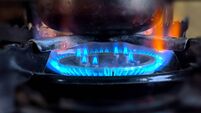 Fire gas flame close-up blurred background, cooking coffee in a cezve on fire