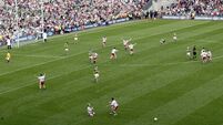 Tyrone palyers celebrate at the final whistle with Peter Canavan in the foreground 25/9/2005