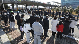 <p>Grieving relatives of people killed in a plane crash in South Korea visited the site to pay respects to their loved ones on New Year’s Day Picture: Kim Sun-woong/Newsis/AP</p>