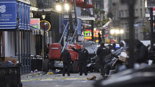 <p>Emergency services attend the scene on Bourbon Street after a vehicle drove into a crowd on New Orleans' Canal and Bourbon Street, Wednesday Jan. 1, 2025. (AP Photo/Gerald Herbert)</p>