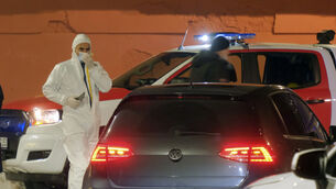 Police investigators work at the site of a shooting in Cetinje (Risto Bozovic/AP)