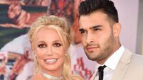 HOLLYWOOD, CA - JULY 22: Britney Spears (L) and Sam Asghari attend the Sony Pictures' "Once Upon A Time...In Hollywood" Los Ange