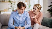 Mother gave her son a consoling pat on the back