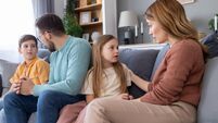 Family in a serious conversation at home