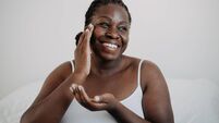 Skin care using cosmetic skin cream Woman with black skin