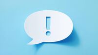 Circular White Chat Bubble With Cut Out Exclamation Point Sitting On Blue Background