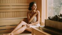 Young woman relaxing in the sauna