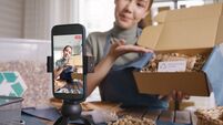 SME owner go green net zero retail store live stream talk on phone showing eco care plastic free packaging box. Asia people youn