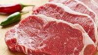 Slices of New York Strip Steak on cutting board