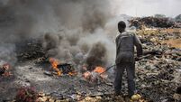 Incineration of electronic waste on the biggest electronic scrap yard of Africa in Accra