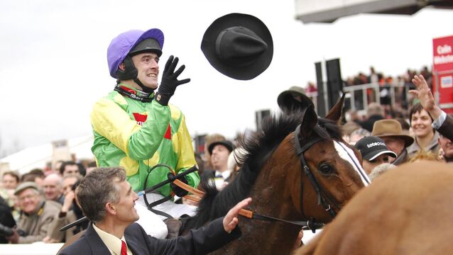 <p>HATS OFF: Jockey Ruby Walsh aboard Kauto Star celebrates after winning the 2007 Totesport Cheltenham Gold Cup Chase. Pic: Paul Mohan / SPORTSFILE</p>