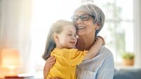 girl and her grandmother enjoying sunny morning