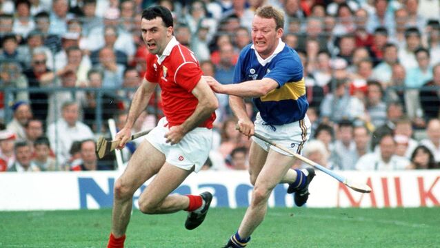 <p>FULL FLOW: Ger Fitzgerald of Cork races away from Tipp's Bobby Ryan during the 1990 Munster final. Pic: Ray McManus/Sportsfile</p>