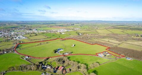 €16,500/acre sought for South Tipp holding with house, castle, and pasture
