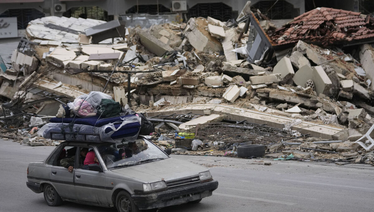 Displaced residents drive past the rubble of destroyed buildings in Tyre as they return to their villages following a ceasefire between Israel and Hezbollah in November 2024. Picture: AP Displaced residents drive past the rubble of destroyed buildings in Tyre as they return to their villages following a ceasefire between Israel and Hezbollah in November 2024. Picture: AP