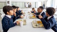 Group of children eating their lunch at the school