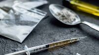 drug syringe and cooked heroin on spoon. drug addict problem and therapy concept