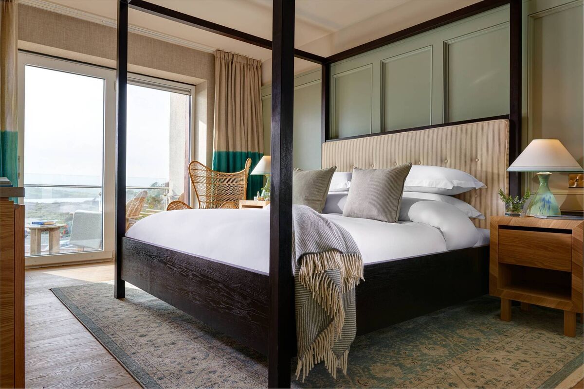 The palette is soft hues of warm creams, sea-foam greens, and dusky blues