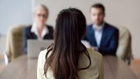 Businesswoman and businessman HR manager interviewing woman