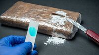 Positive cocaine test result in seized drug package from police trafficking operation.