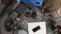 Top view of man's stuff ready for packing and going on a vacation
