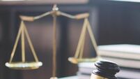 Scales of justice and Gavel on wooden table and Lawyer or Judge working with agreement in Courtroom, Justice and Law concept