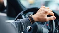 An Unrecognizable Businessman Driving His Car