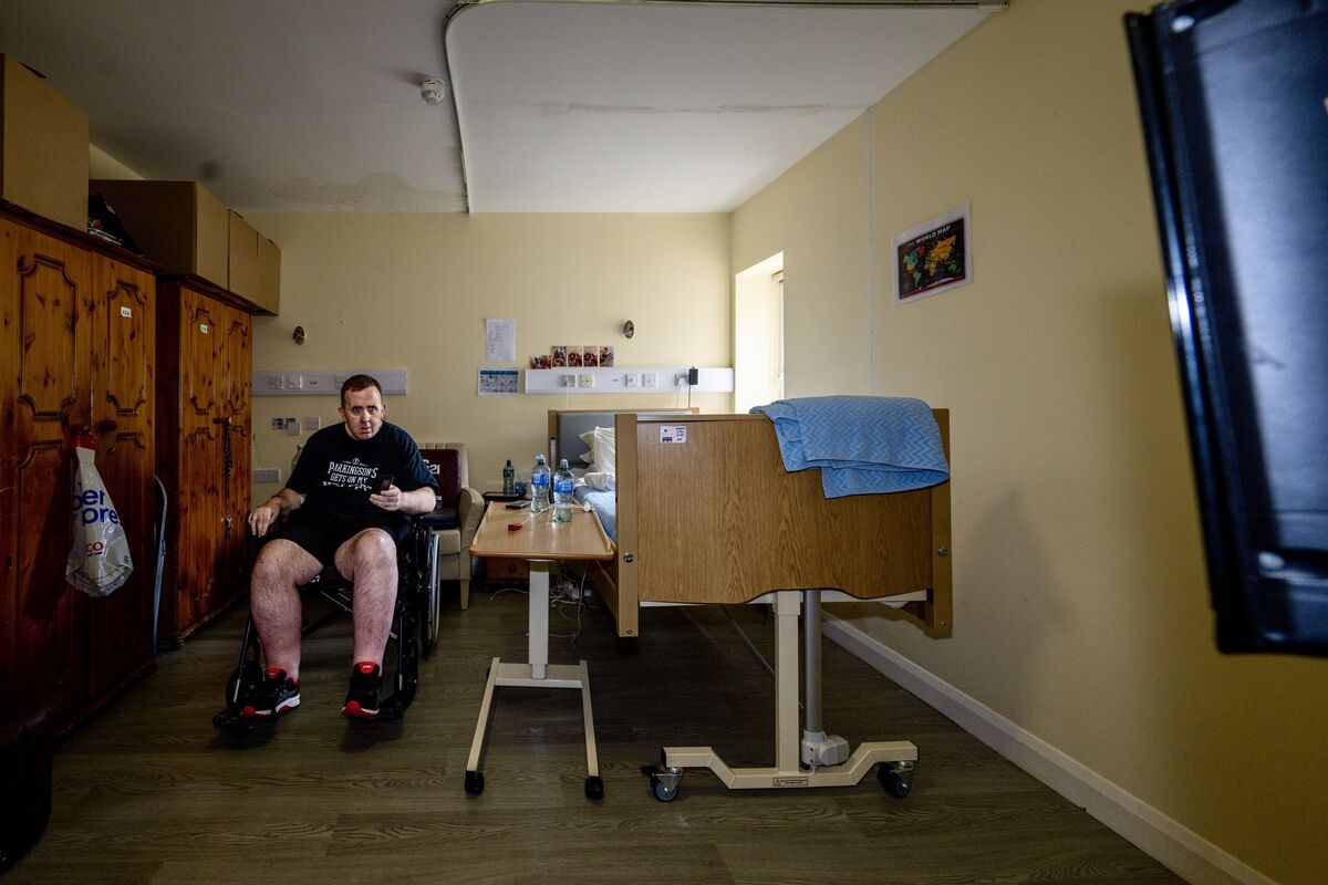 At just 47, Colm O’Cathain, who suffers from Parkinson’s disease spends most of his days watching television in his room in a nursing home designed for much older residents. With his condition progressing rapidly, Colm’s savings are paying for care that doesn’t meet his needs. Picture: Chani Anderson At just 47, Colm O’Cathain, who suffers from Parkinson’s disease spends most of his days watching television in his room in a nursing home designed for much older residents. With his condition progressing rapidly, Colm’s savings are paying for care that doesn’t meet his needs. Picture: Chani Anderson