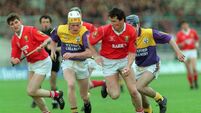 Tomas Mulcahy runs on despite loosing his hurl 1993