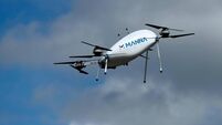 Manna Aero drone is seen as it delivers essential household and medical supplies in the Irish village of Moneygall