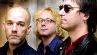 Members of the American rock group R.E.M from L Mi