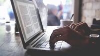 using a laptop in a cafe