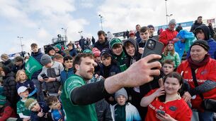 <p>MAKING A BIG MACK MEAL OF IT: Connacht’s Mack Hansen with fans after the Connacht-Munster clash at MacHale Park. Pic: INPHO/James Crombie</p>