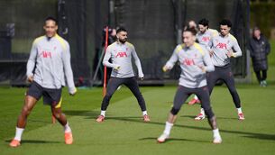 <p>STUCK IN THE MIDDLE: Liverpool's Mohamed Salah (centre left) during a training session at AXA Training Centre, Liverpool. Pic: Peter Byrne/PA Wire</p>