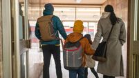 Happy family on train station