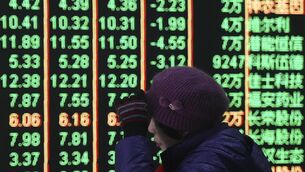 <p>Tokyo's Nikkei fell to 3%, reflecting eight-month lows, which led heavy losses across Asia.(Chinatopix Via AP)</p>