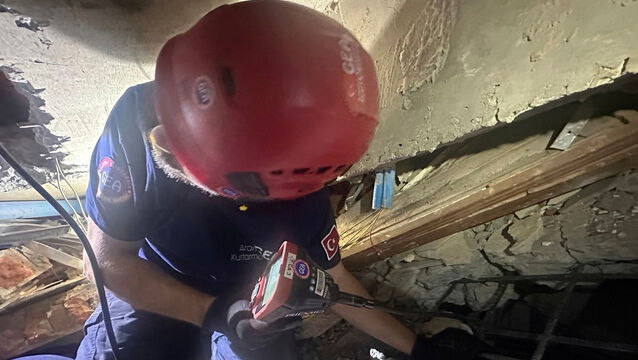 <p>Rescuers pulling two men alive from the ruins of a hotel in Myanmar's capital, Wednesday, April 2, 2025. (GEA Search and Rescue via AP)</p>